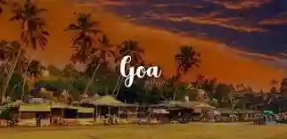 Golden sunset over Goa beach with palm trees silhouette